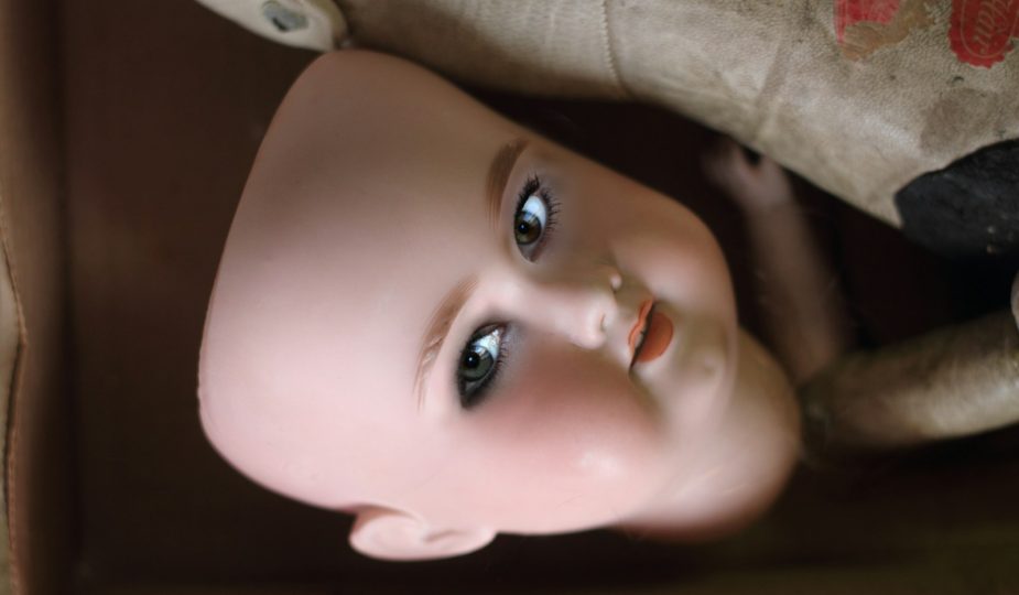 closeup photo of doll face